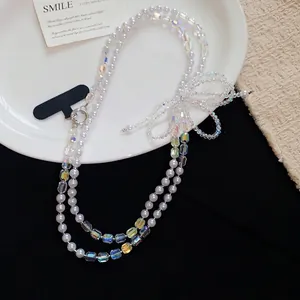Lanière de téléphone élégante en perles et cristal avec nœud en perles