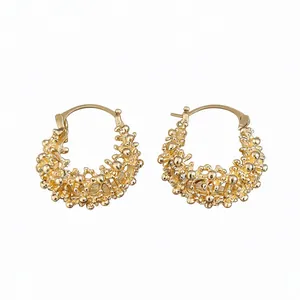 Elegant French style hollow gold hoop earrings with intricate basket weave design