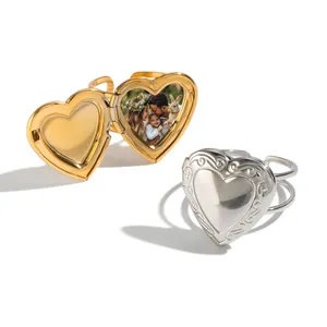 Elegant heart-shaped stainless steel locket rings in gold and silver with photo frame.