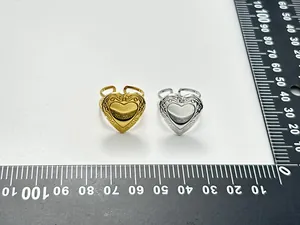 Detailed view of adjustable stainless steel heart locket rings in gold and silver finish