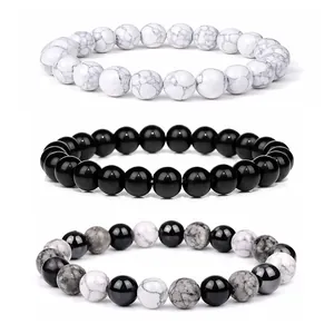Set di tre braccialetti in perline di pietra naturale in bianco, nero e marmo grigio