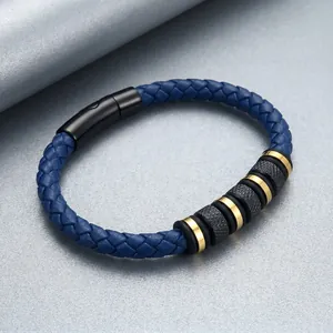 Detailed view of blue braided leather bracelet with knurled steel beads.