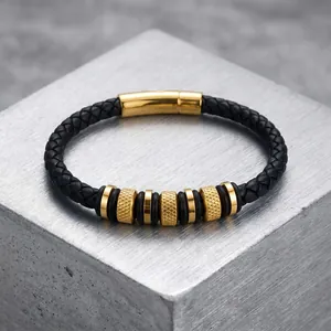 Close-up detail of men's braided leather bracelet with gold knurled stainless steel beads