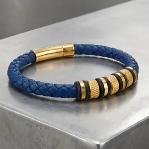Close-up of blue braided leather bracelet with knurled gold steel beads and magnetic clasp