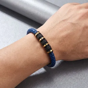Close-up of men's blue braided leather bracelet with knurled stainless steel beads