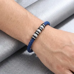 Close-up of men's blue woven leather bracelet with knurled stainless steel beads