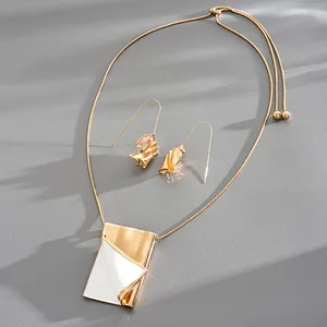 Detailed shot of creative metal dripping oil necklace with folded book-like pendant