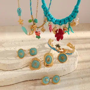 Ocean-themed jewelry set featuring turquoise enamel and 18K gold plated seaside charms