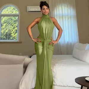 Detail shot of a sexy olive green halter neck maxi dress worn by a model
