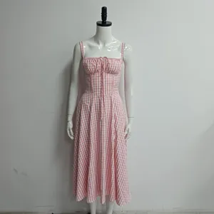 Front view of a pink gingham midi dress on a mannequin showing corset details