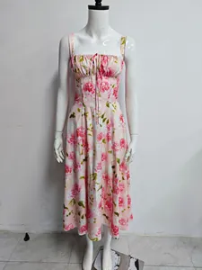 Detailed front view of pink floral corset midi dress with ruched bodice and front tie