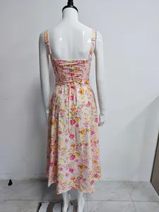 Back view of pink floral print maxi dress featuring elegant lace-up corset design.