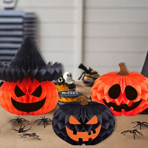 Set of three Halloween honeycomb paper pumpkin decorations for spooky party scene setup