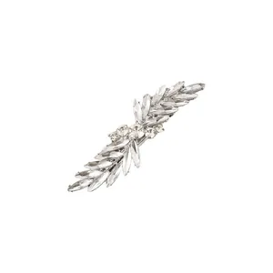 Detail of a sparkling rhinestone hair clip with leaf-shaped crystals on silver alloy