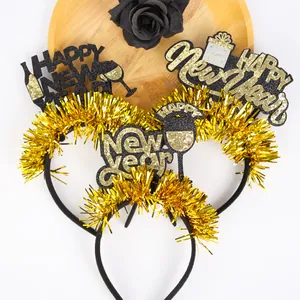 Detailed view of festive New Year headbands with gold tinsel and glittery holiday designs