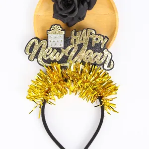 Detail view of festive black and gold glitter Happy New Year headband with gold tinsel