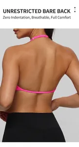 Close-up detail of a vibrant pink halter neck sports bra showing the open back design