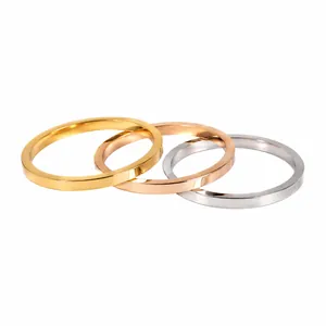 Set of three minimalist 2mm stainless steel plain rings in gold, rose gold, and silver