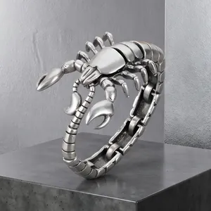 Close-up of vintage silver scorpion titanium steel men's bracelet on stone base