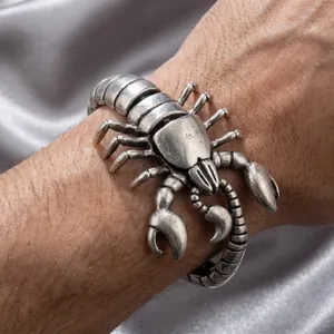 Antique silver scorpion-shaped men's bracelet with detailed textures and bold style.