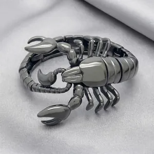 Detailed view of a gunmetal scorpion-shaped men's bracelet made of titanium steel
