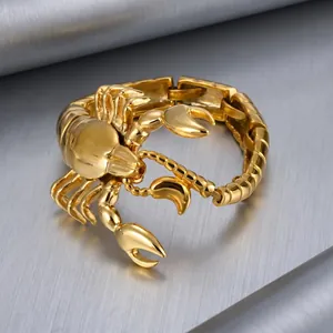 Detailed macro view of a polished gold titanium steel scorpion bracelet for men