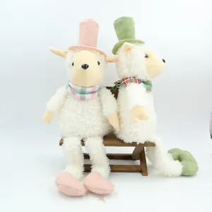 Two curly hair sheep plush toys with colorful top hats and checkered neck scarves.