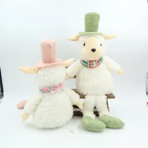 Set of vintage curly hair sheep plush toys with top hats and plaid scarves on bench