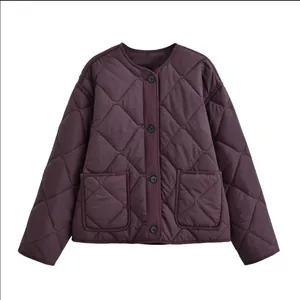 Detailed front view of a stylish purple quilted jacket featuring a round neck and pockets.