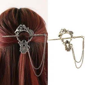 Detail showing vintage mushroom bird design on alloy hair stick with metal chain