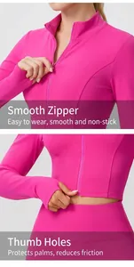 Gros plan d'une veste de sport rose fuchsia avec fermeture éclair fluide et poignets passe-pouces
