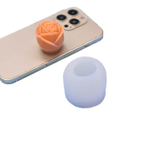 Rose flower silicone mold for DIY scented candles and ice cubes shown on a smartphone