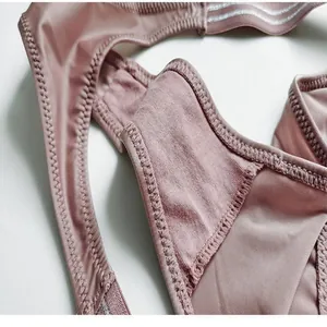 Close-up of pink ice silk thong showing soft fabric texture and high-cut elastic band