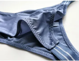 Close-up detail of the smooth blue ice silk fabric and durable elastic band of this thong.
