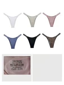 Detail view of seamless ice silk thongs in multiple colors and fabric care label