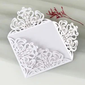 Intricate white laser-cut lace invitation card cover for wedding or formal party