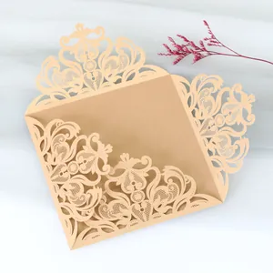 Elegant champagne gold laser cut lace wedding invitation cover with intricate details.