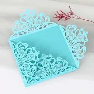 Detailed view of elegant cyan laser-cut lace wedding invitation shell for parties