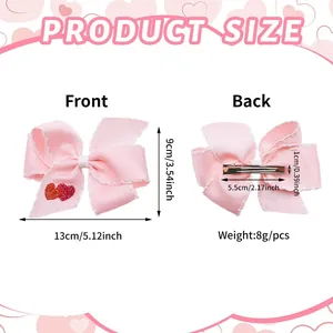 Size diagram of a pink ribbon bow hair clip with heart embroidery