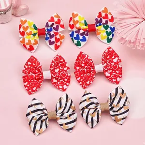 Detailed view of colorful heart patterned grosgrain bow hair clips for girls set
