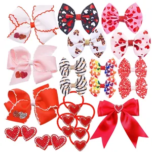 Collection of festive heart-patterned hair bows and clips for Valentine's Day gift.