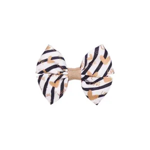 Fermaglio per capelli a fiocco con strisce nere e stampe di cuori color oro