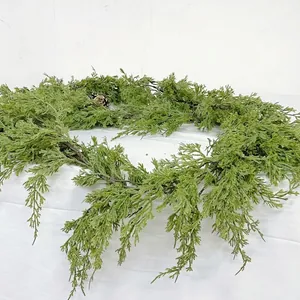 Detailed view of artificial green cypress leaf garland for Christmas home decor
