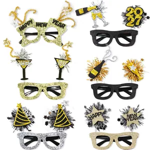 Variety of 2027 New Year themed party glasses with glitter stars and tinsel decoration