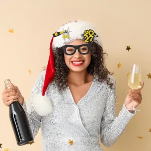 2027 black and gold glitter New Year party glasses and Santa hat photo props on a model