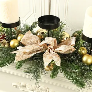 Festive Christmas candle holder centerpiece with green pine needles and gold ornaments