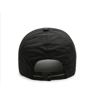 Close-up detail of the adjustable back buckle on a black mesh quick-dry sports baseball cap