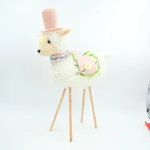 Detailed side view of pastoral plush sheep doll with a pink hat and sturdy wooden legs
