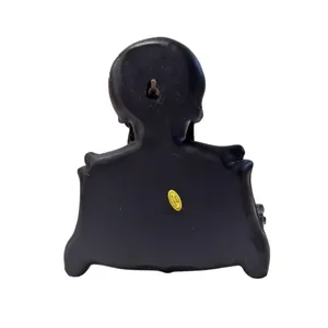 Detailed back view of vintage resin skull wall-mounted tissue holder with wall hole