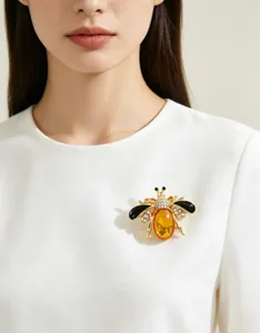 Elegant gold-tone honey bee brooch with amber stone and sparkling rhinestones for women